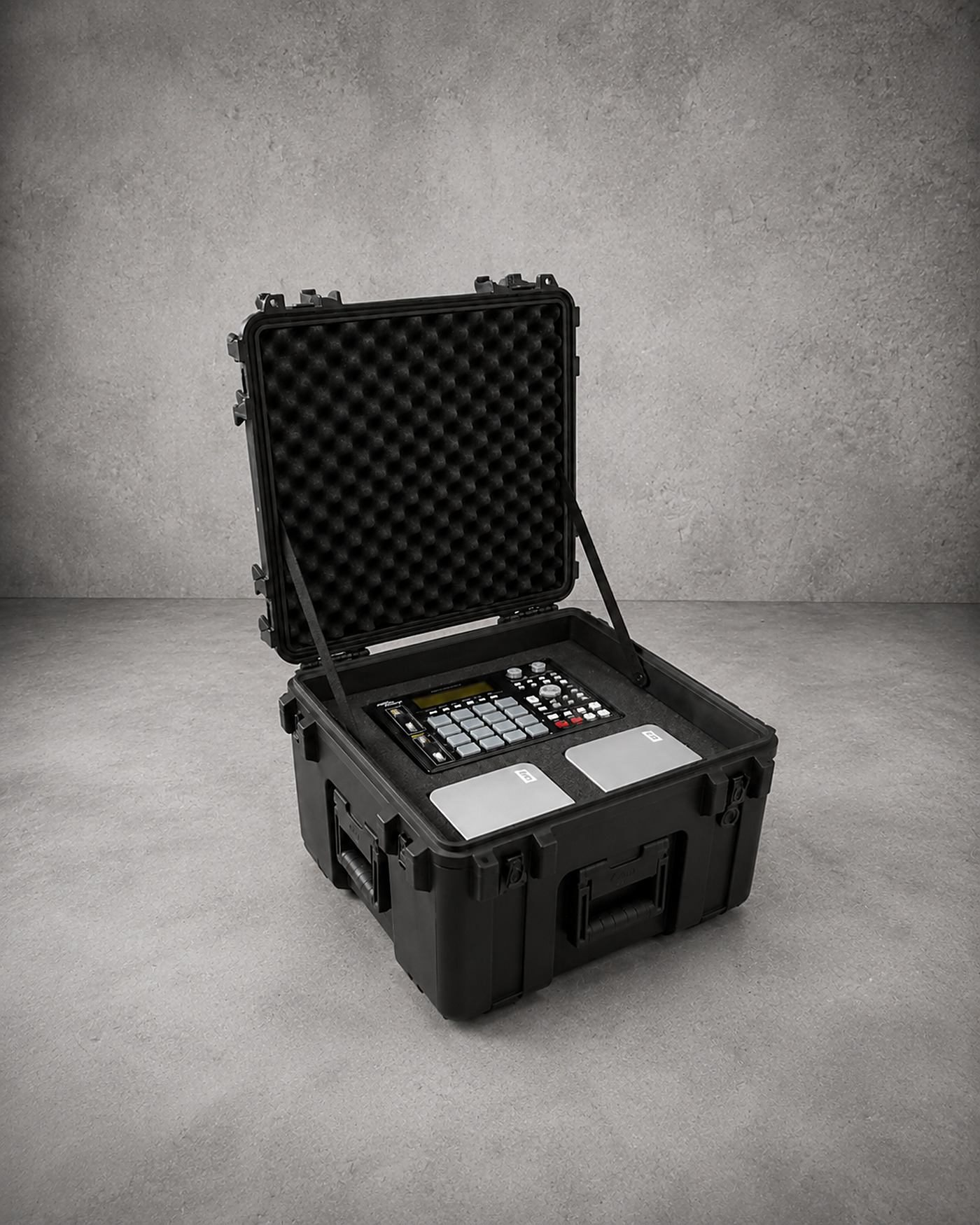 An open protective case with a custom foam insert cradling an electronic control unit