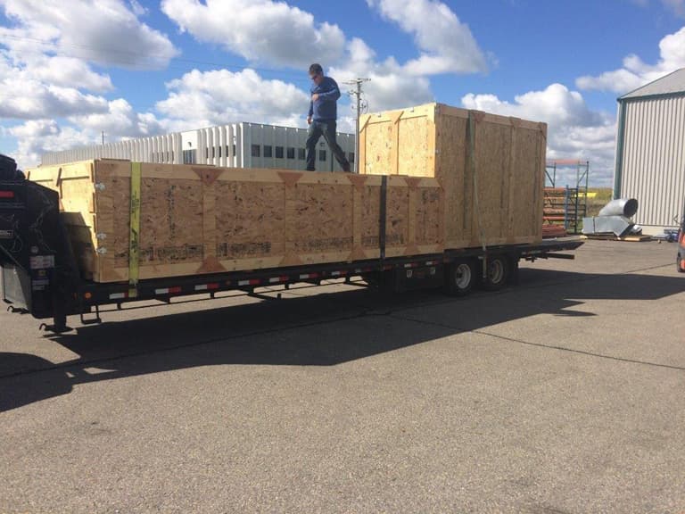 A large crate staged outside for shipment