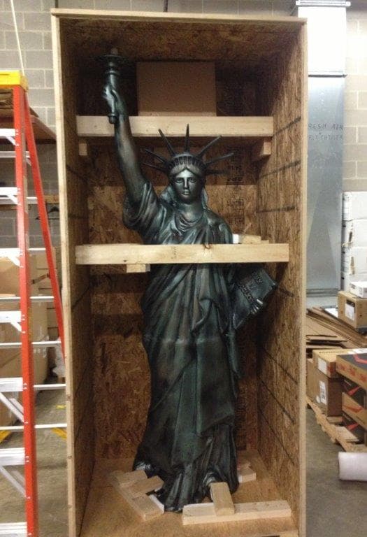A Statue of Liberty replica braced inside a custom-built FoamCraft wood crate